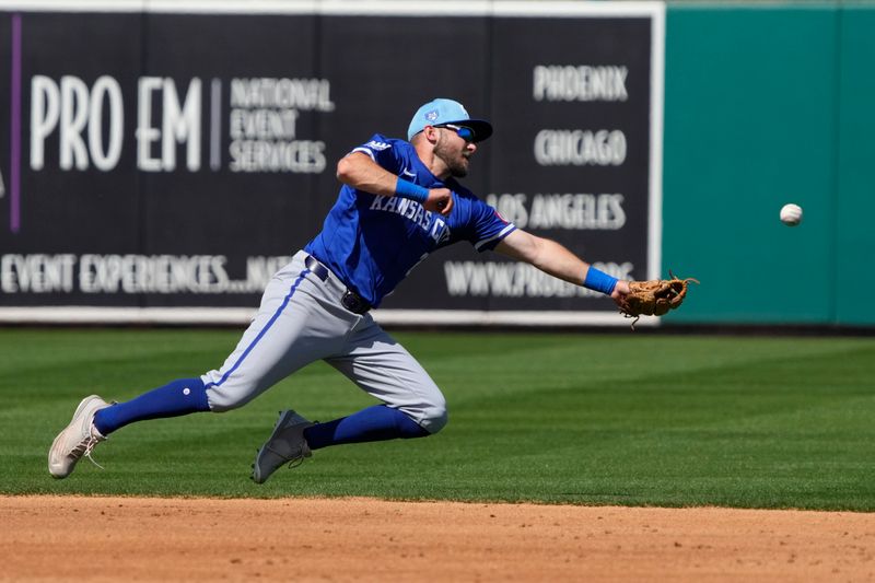 Mar 10, 2024; Mesa, Arizona, USA; Kansas City Royals shortstop Garrett Hampson (2) dives for the ball against the Oakland Athletics in the second inning at Hohokam Stadium. Mandatory Credit: Rick Scuteri-USA TODAY Sports