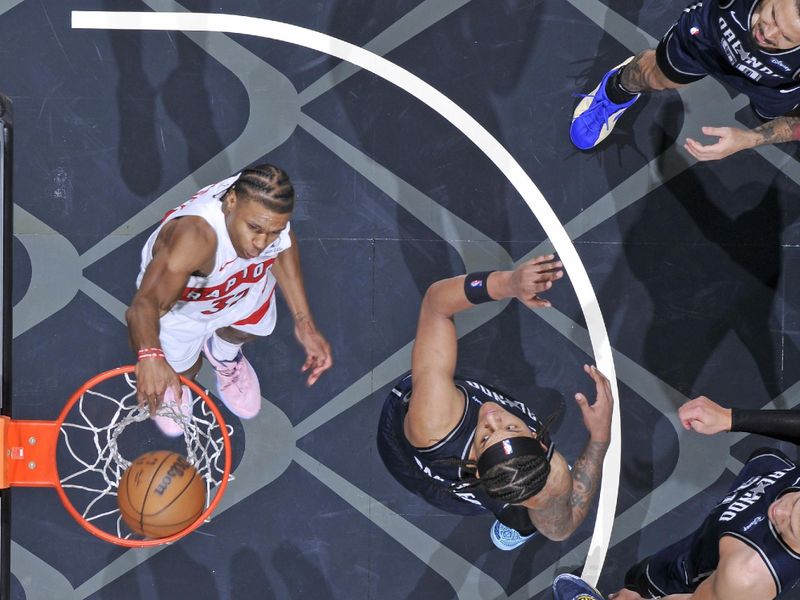 ORLANDO, FL - MARCH 17: Jahmi'us Ramsey #37 of the Toronto Raptors dunks the ball during the game against the Orlando Magic on March 17, 2024 at the Kia Center in Orlando, Florida. NOTE TO USER: User expressly acknowledges and agrees that, by downloading and or using this photograph, User is consenting to the terms and conditions of the Getty Images License Agreement. Mandatory Copyright Notice: Copyright 2024 NBAE (Photo by Fernando Medina/NBAE via Getty Images)