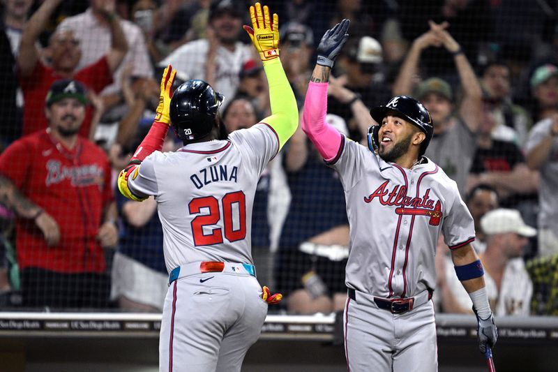 Jul 12, 2024; San Diego, California, USA; Atlanta Braves designated hitter Marcell Ozuna (20) is congratulated by left fielder Eddie Rosario (8) after hitting a home run against the San Diego Padres during the ninth inning at Petco Park. Mandatory Credit: Orlando Ramirez-USA TODAY Sports 