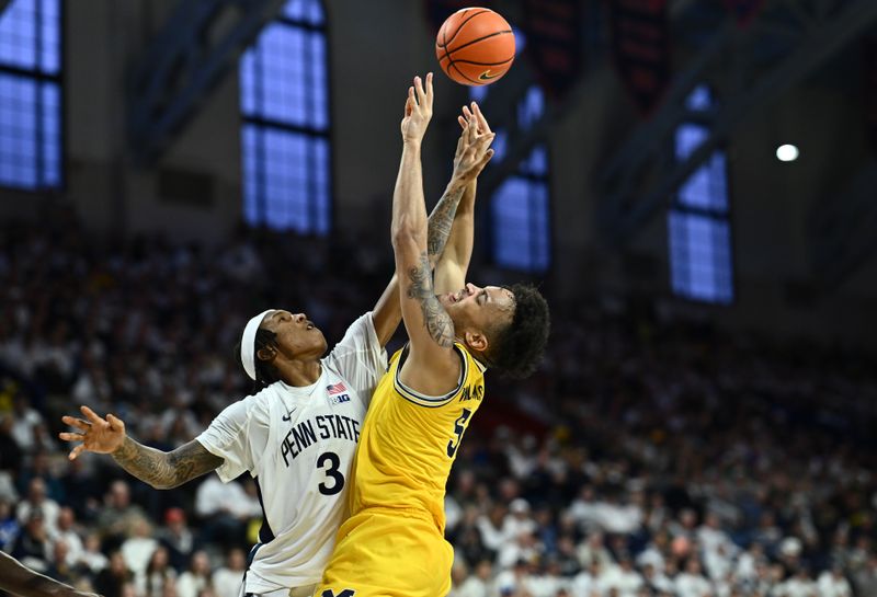 Jan 7, 2024; Philadelphia, Pennsylvania, USA; Penn State Nittany Lions guard Nick Kern Jr (3) defends a shot from Michigan Wolverines forward Terrance Williams II (5) in the second half at The Palestra. Mandatory Credit: Kyle Ross-USA TODAY Sports