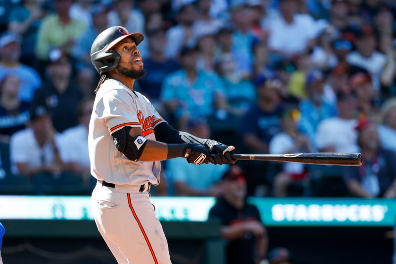 Aug 13, 2023; Seattle, Washington, USA; Baltimore Orioles center fielder Cedric Mullins (31) watches his two-run home run against the Seattle Mariners during the tenth inning at T-Mobile Park. Mandatory Credit: Joe Nicholson-USA TODAY Sports