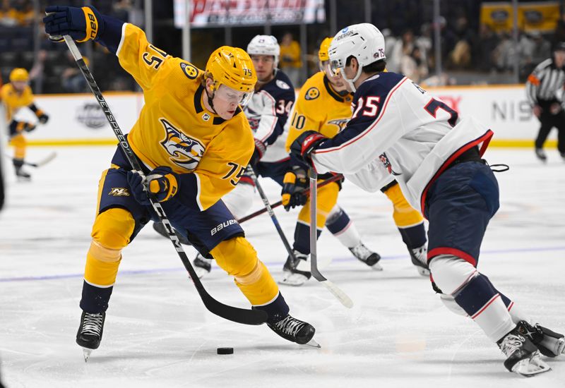 Jan 17, 2023; Nashville, Tennessee, USA;  Nashville Predators center Juuso Parssinen (75) skates as Columbus Blue Jackets defenseman Gavin Bayreuther (15) defends during the first period at Bridgestone Arena. Mandatory Credit: Steve Roberts-USA TODAY Sports