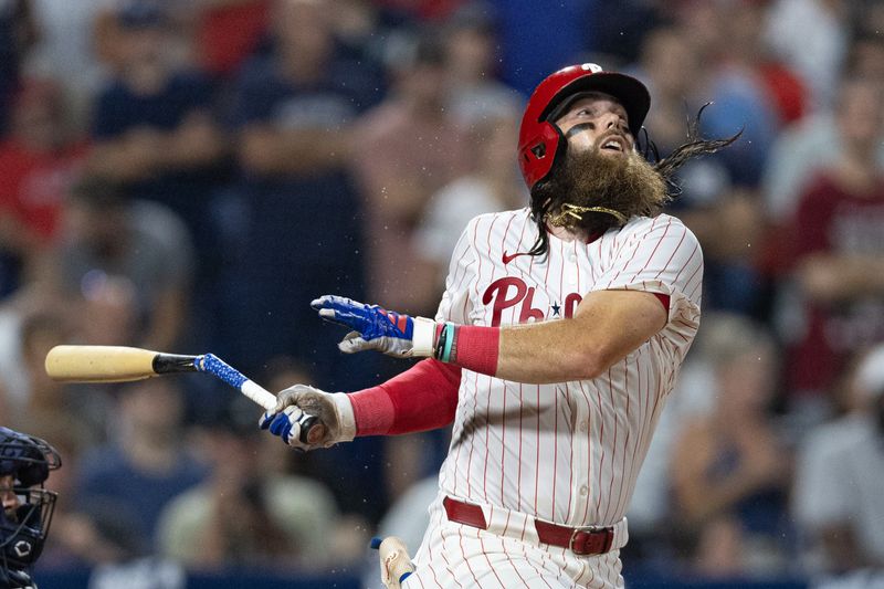 Jul 30, 2024; Philadelphia, Pennsylvania, USA; Philadelphia Phillies outfielder Brandon Marsh (16) breaks his bat while hitting into an out against the New York Yankees during the tenth inning at Citizens Bank Park. Mandatory Credit: Bill Streicher-USA TODAY Sports