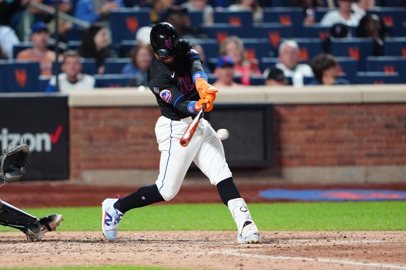 May 31, 2024; New York City, New York, USA; New York Mets shortstop Francisco Lindor (12) hits a single against the Arizona Diamondbacks during the fifth inning at Citi Field. Mandatory Credit: Gregory Fisher-USA TODAY Sports