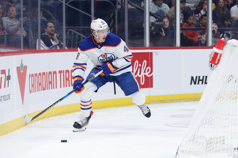 Sep 25, 2024; Winnipeg, Manitoba, CAN; Edmonton Oilers forward Noah Philp (48) looks to make a pass against the Winnipeg Jets during the first period at Canada Life Centre. Mandatory Credit: Terrence Lee-Imagn Images