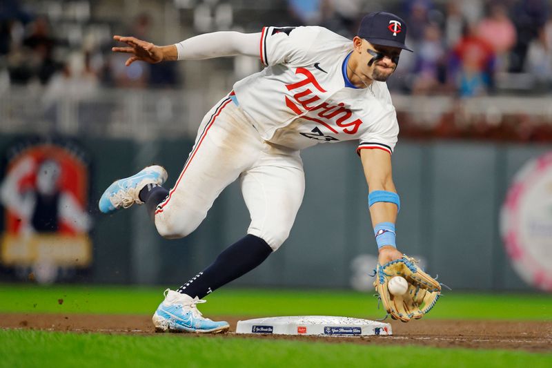 Sep 24, 2024; Minneapolis, Minnesota, USA; Minnesota Twins third baseman Royce Lewis (23) fields a ball hit by Miami Marlins third baseman Connor Norby (not pictured) in the ninth inning at Target Field. Mandatory Credit: Bruce Kluckhohn-Imagn Images