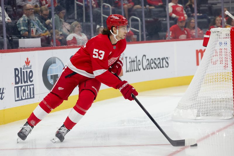 Oct 4, 2024; Detroit, Michigan, USA;  Detroit Red Wings defenseman Moritz Seider (53) skates with the puck in the first period against the Ottawa Senators at Little Caesars Arena. Mandatory Credit: Rick Osentoski-Imagn Images