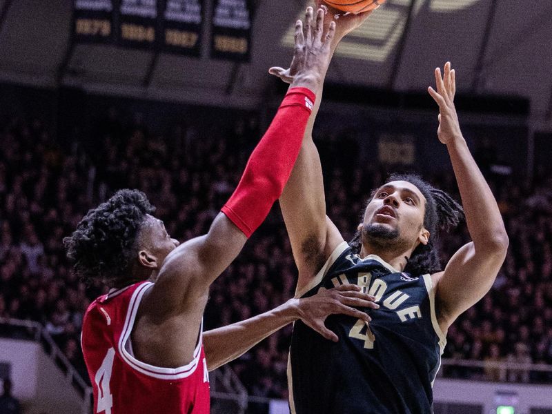 Feb 10, 2024; West Lafayette, Indiana, USA; Purdue Boilermakers forward Trey Kaufman-Renn (4) shoots the ball while Indiana Hoosiers forward Anthony Walker (4) defends in the second half at Mackey Arena. Mandatory Credit: Trevor Ruszkowski-USA TODAY Sports