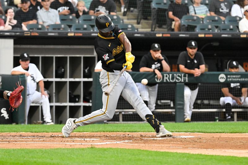 Jul 12, 2024; Chicago, Illinois, USA;  Pittsburgh Pirates outfielder Michael A. Taylor (18) doubles during the third inning against the Chicago White Sox at Guaranteed Rate Field. Mandatory Credit: Matt Marton-USA TODAY Sports