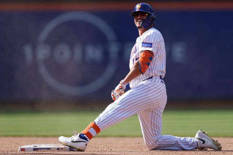 Apr 20, 2025; New York City, New York, USA; New York Mets right fielder Tyrone Taylor (15) reacts after hitting an RBI double during the eighth inning against the St. Louis Cardinals at Citi Field. Mandatory Credit: Vincent Carchietta-Imagn Images
