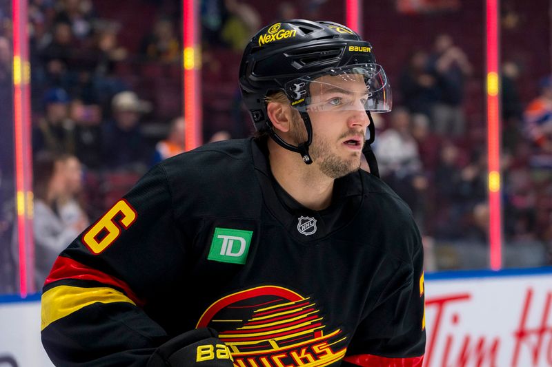 Nov 9, 2024; Vancouver, British Columbia, CAN; Vancouver Canucks defenseman Erik Brannstrom (26) skates during warm up prior to a game against the Edmonton Oilers at Rogers Arena. Mandatory Credit: Bob Frid-Imagn Images