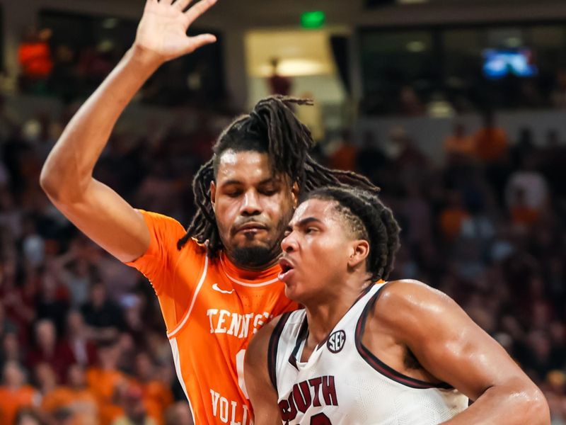 Mar 6, 2024; Columbia, South Carolina, USA; South Carolina Gamecocks forward Collin Murray-Boyles (30) drives into Tennessee Volunteers forward Jonas Aidoo (0) in the second half at Colonial Life Arena. Mandatory Credit: Jeff Blake-USA TODAY Sports