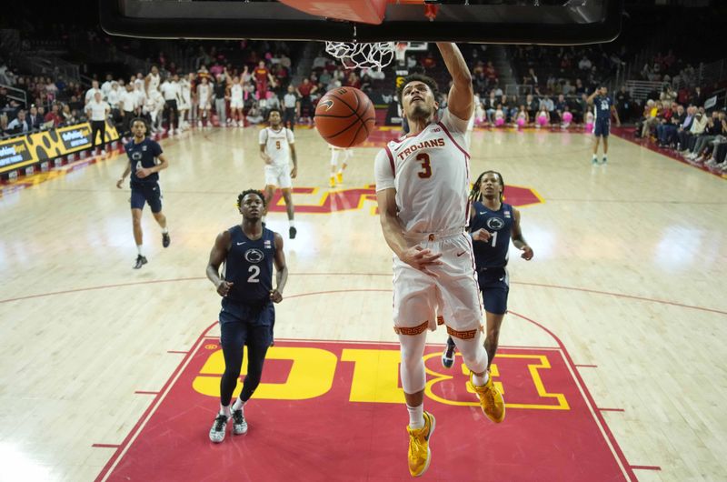 Feb 11, 2025; Los Angeles, California, USA; Southern California Trojans forward Matt Knowling (3) dunks the ball against the Penn State Nittany Lions in the first half at Galen Center. Mandatory Credit: Kirby Lee-Imagn Images