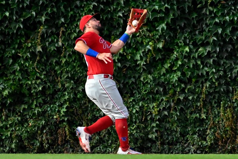 Jun 29, 2023; Chicago, Illinois, USA;  Philadelphia Phillies left fielder Kyle Schwarber (12) drops a fly ball hit by Chicago Cubs center fielder Mike Tauchman (40) during the fifth inning at Wrigley Field. Mandatory Credit: Matt Marton-USA TODAY Sports