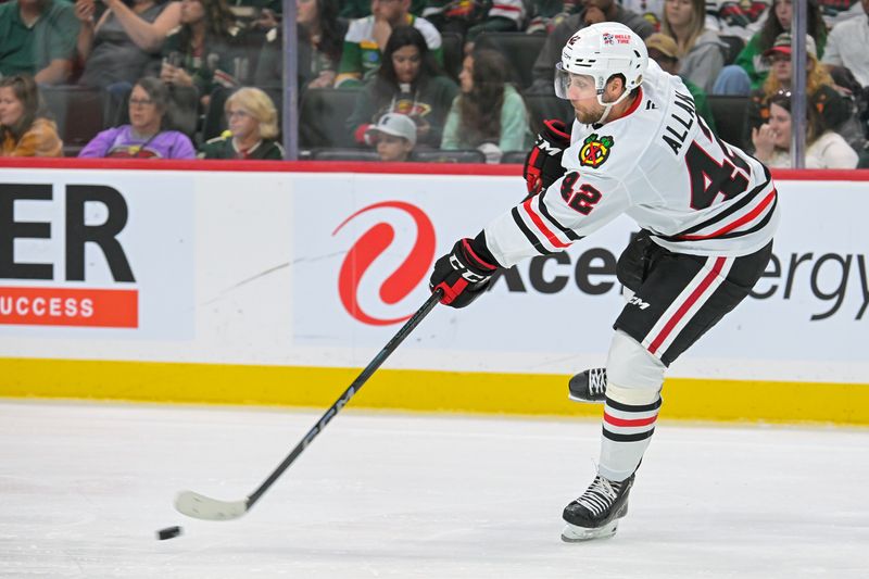 Sep 28, 2025; Saint Paul, Minnesota, USA;  Chicago Blackhawks defensemen Nolan Allan (42) takes a shot against the Minnesota Wild during the third period at Xcel Energy Center. Mandatory Credit: Nick Wosika-Imagn Images
