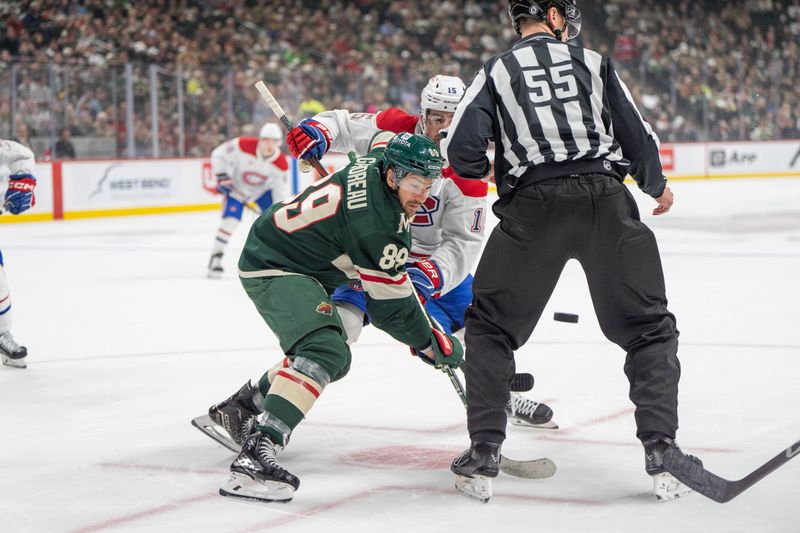 Nov 14, 2024; Saint Paul, Minnesota, USA; Minnesota Wild center Frederick Gaudreau (89) and Montreal Canadiens center Alex Newhook (15) face off with linesman Kyle Flemington (55) in the first period at Xcel Energy Center. Mandatory Credit: Matt Blewett-Imagn Images