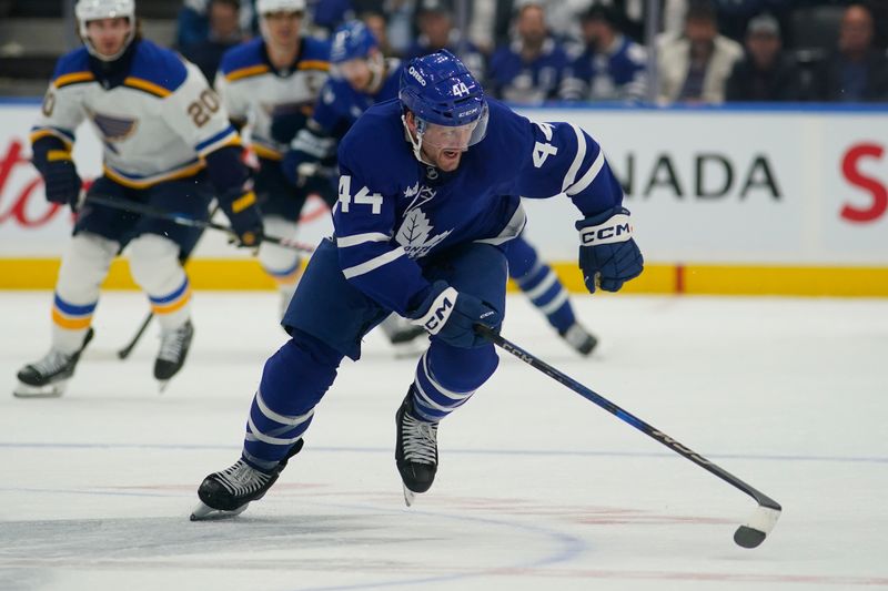 Oct 24, 2024; Toronto, Ontario, CAN; Toronto Maple Leafs defenseman Morgan Rielly (44) skates against the St. Louis Blues during the second period at Scotiabank Arena. Mandatory Credit: John E. Sokolowski-Imagn Images