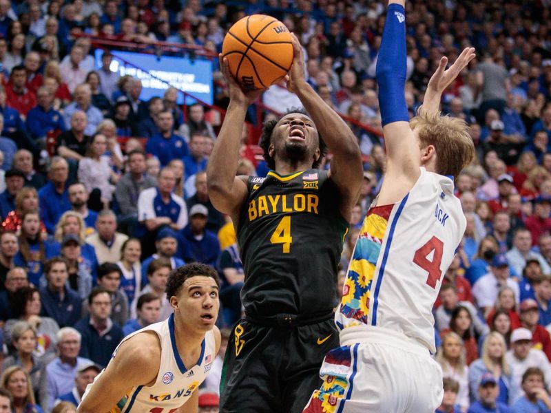 Feb 18, 2023; Lawrence, Kansas, USA; Baylor Bears guard LJ Cryer (4) puts up a shot over Kansas Jayhawks guard Gradey Dick (4) during the first half at Allen Fieldhouse. Mandatory Credit: William Purnell-USA TODAY Sports