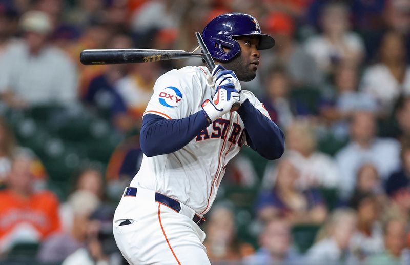 Sep 11, 2024; Houston, Texas, USA; Houston Astros designated hitter Yordan Alvarez (44) breaks his bat on a single during the third inning against the Oakland Athletics at Minute Maid Park. Mandatory Credit: Troy Taormina-Imagn Images