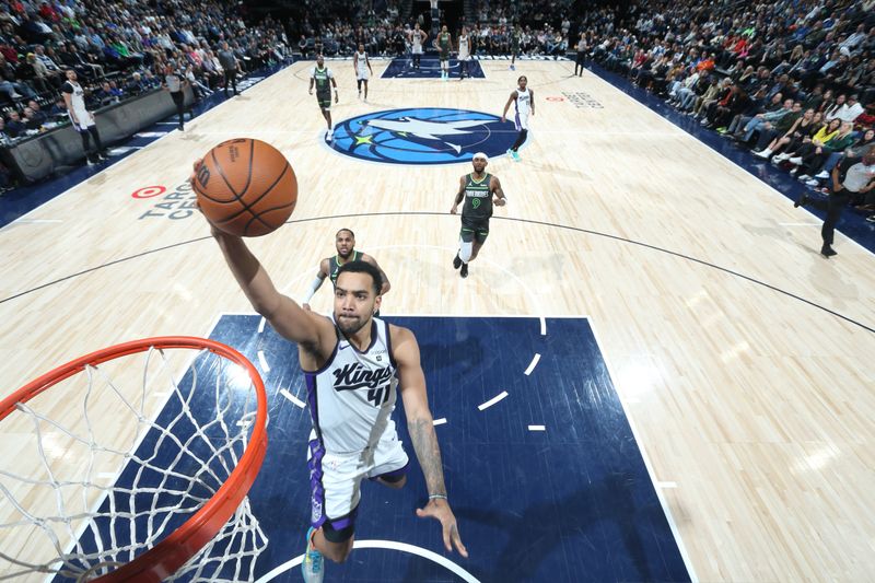 MINNEAPOLIS, MN -  MARCH 1: Trey Lyles #41 of the Sacramento Kings drives to the basket during the game against the Minnesota Timberwolves on March 1, 2024 at Target Center in Minneapolis, Minnesota. NOTE TO USER: User expressly acknowledges and agrees that, by downloading and or using this Photograph, user is consenting to the terms and conditions of the Getty Images License Agreement. Mandatory Copyright Notice: Copyright 2024 NBAE (Photo by David Sherman/NBAE via Getty Images)