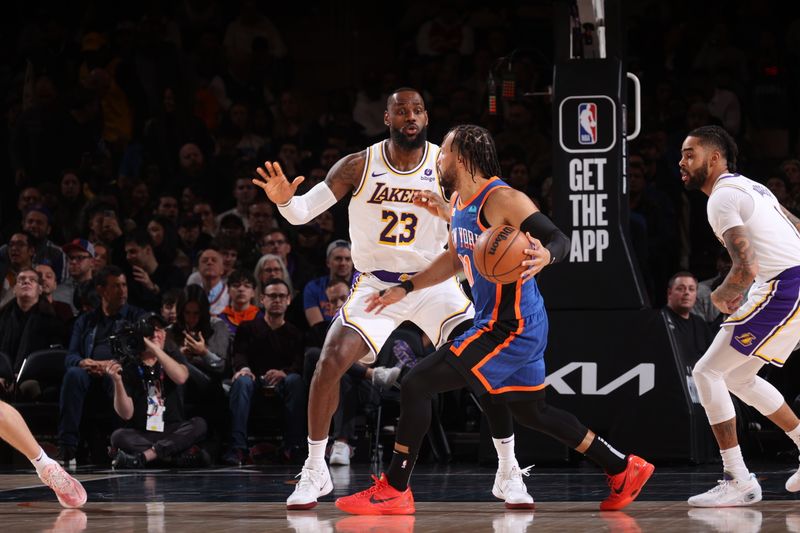 NEW YORK, NY - FEBRUARY 3: Jalen Brunson #11 of the New York Knicks handles the ball against LeBron James #23 of the Los Angeles Lakers during the game on February 3, 2024 at Madison Square Garden in New York City, New York.  NOTE TO USER: User expressly acknowledges and agrees that, by downloading and or using this photograph, User is consenting to the terms and conditions of the Getty Images License Agreement. Mandatory Copyright Notice: Copyright 2024 NBAE  (Photo by Nathaniel S. Butler/NBAE via Getty Images)