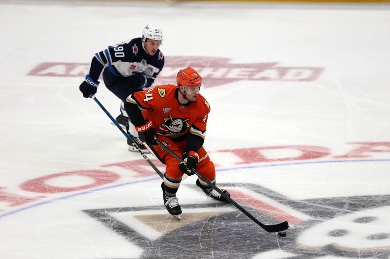 Nov 9, 2025; Anaheim, California, USA;  Anaheim Ducks left wing Ross Johnston (44) skates with the puck during the third period against the Winnipeg Jets at Honda Center. Mandatory Credit: Kiyoshi Mio-Imagn Images