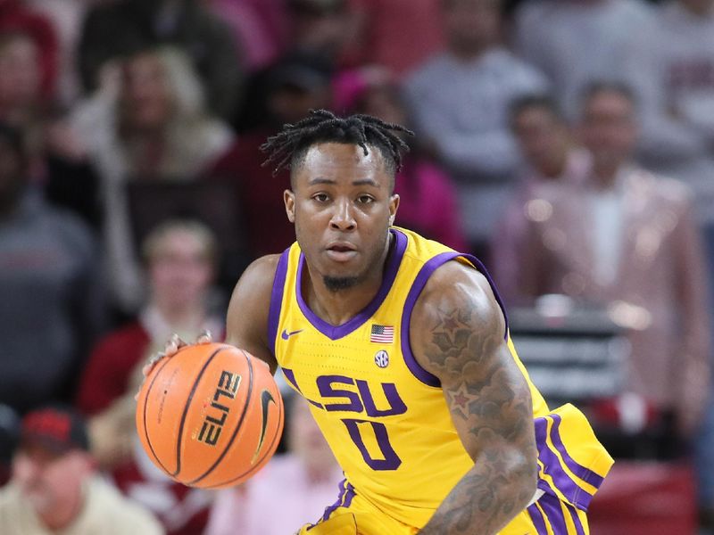 Jan 24, 2023; Fayetteville, Arkansas, USA; LSU Tigers guard Trae Hannibal (0) dribbles during the second half against the Arkansas Razorbacks at Bud Walton Arena. Arkansas won 60-40. Mandatory Credit: Nelson Chenault-USA TODAY Sports