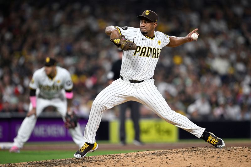 Jul 6, 2024; San Diego, California, USA; San Diego Padres relief pitcher Wandy Peralta (58) pitches against the Arizona Diamondbacks during the tenth inning at Petco Park. Mandatory Credit: Orlando Ramirez-USA TODAY Sports