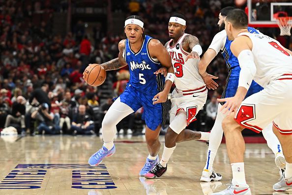 CHICAGO, ILLINOIS - NOVEMBER 15:  Paolo Banchero #5 of the Orlando Magic controls the ball against the Chicago Bulls on November 15, 2023 at United Center in Chicago, Illinois.   NOTE TO USER: User expressly acknowledges and agrees that, by downloading and or using this photograph, User is consenting to the terms and conditions of the Getty Images License Agreement.  (Photo by Jamie Sabau/Getty Images)