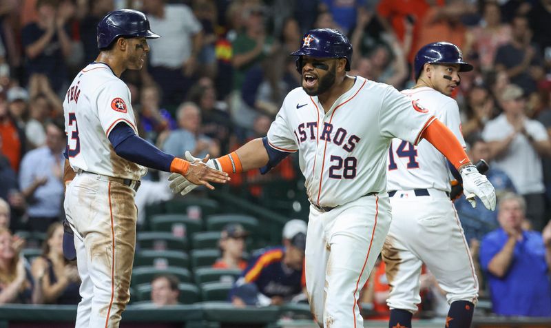 May 2, 2024; Houston, Texas, USA; Houston Astros first baseman Jon Singleton (28) celebrates with shortstop Jeremy Pena (3) after hitting a home run during the sixth inning against the Cleveland Guardians at Minute Maid Park. Mandatory Credit: Troy Taormina-USA TODAY Sports