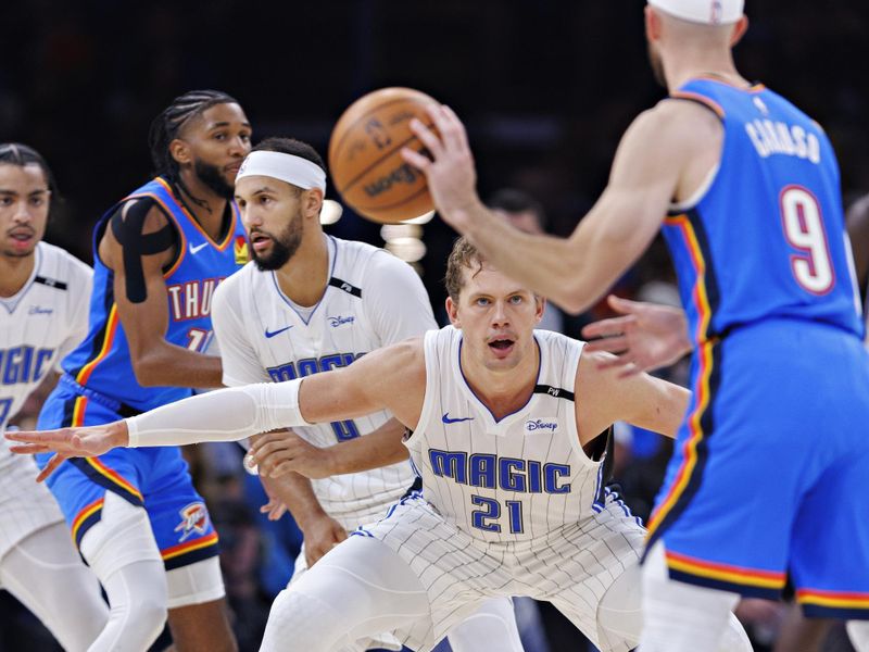 OKLAHOMA CITY, OKLAHOMA - NOVEMBER 4: Moritz Wagner #21 of the Orlando Magic plays defense in the second half against Alex Caruso #9 of the Oklahoma City Thunder at Paycom Center on November 4, 2024 in Oklahoma City, Oklahoma. NOTE TO USER: User expressly acknowledges and agrees that, by downloading and or using this Photograph, user is consenting to the terms and conditions of the Getty Images License Agreement. The Thunder defeated the Magic 102-86.  (Photo by Wesley Hitt/Getty Images)