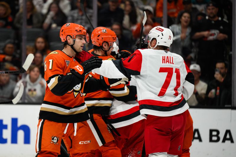 Oct 16, 2025; Anaheim, California, USA; Anaheim Ducks and Carolina Hurricanes players fight after the end of the second period at Honda Center. Mandatory Credit: William Liang-Imagn Images