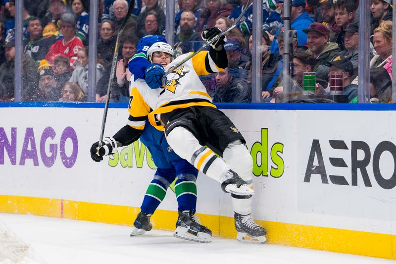 Feb 27, 2024; Vancouver, British Columbia, CAN; Vancouver Canucks forward Arshdeep Bains (80) checks Pittsburgh Penguins defenseman Ryan Graves (27) in the third period at Rogers Arena. Penguins won 4-3 in overtime. Mandatory Credit: Bob Frid-USA TODAY Sports