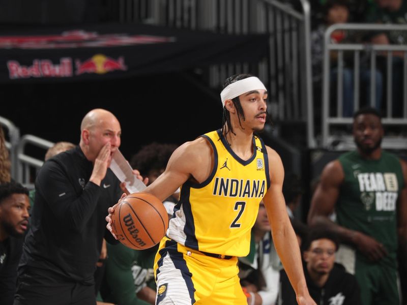 MILWAUKEE, WI - APRIL 21: Andrew Nembhard #2 of the Indiana Pacers dribbles the ball during the game against the Milwaukee Bucks during Round 1 Game 1 of the 2024 NBA Playoffs on April 21, 2024 at the Fiserv Forum Center in Milwaukee, Wisconsin. NOTE TO USER: User expressly acknowledges and agrees that, by downloading and or using this Photograph, user is consenting to the terms and conditions of the Getty Images License Agreement. Mandatory Copyright Notice: Copyright 2024 NBAE (Photo by Gary Dineen/NBAE via Getty Images).