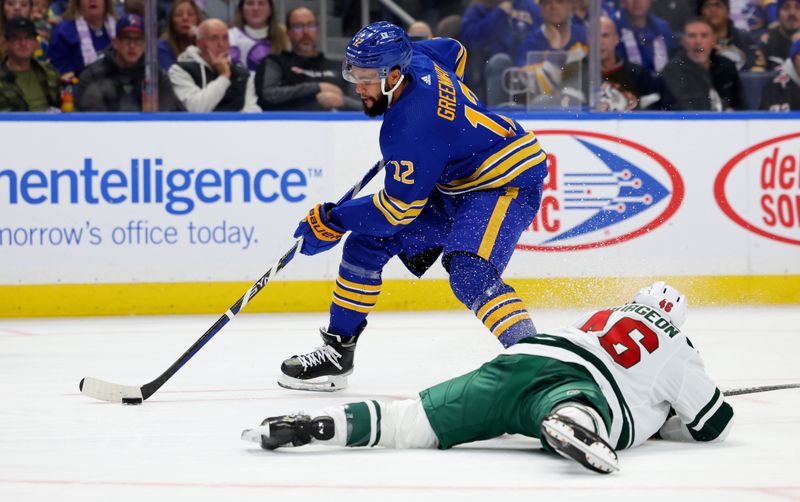 Nov 10, 2023; Buffalo, New York, USA;  Minnesota Wild defenseman Jared Spurgeon (46) dives to try and block a pass by Buffalo Sabres left wing Jordan Greenway (12) during the second period at KeyBank Center. Mandatory Credit: Timothy T. Ludwig-USA TODAY Sports