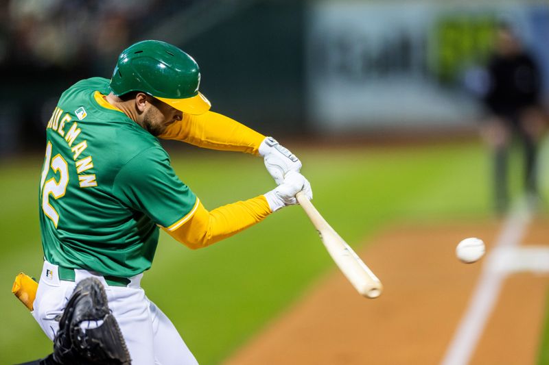 Sep 20, 2024; Oakland, California, USA; Oakland Athletics shortstop Max Schuemann (12) flies out in the the third inning against the New York Yankees at Oakland-Alameda County Coliseum. Mandatory Credit: Bob Kupbens-Imagn Images