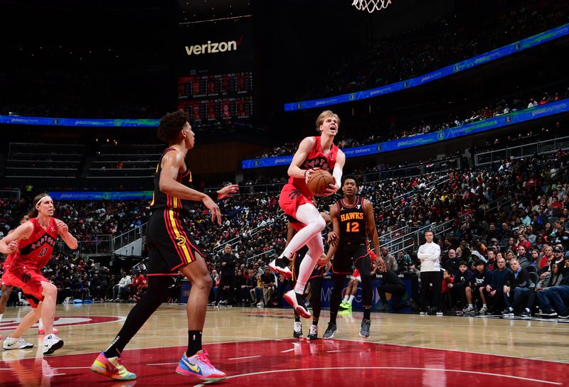 ATLANTA, GA - February 23:  Gradey Dick #1 of the Toronto Raptors drives to the basket during the game against the Atlanta Hawks on February 23, 2024 at State Farm Arena in Atlanta, Georgia.  NOTE TO USER: User expressly acknowledges and agrees that, by downloading and/or using this Photograph, user is consenting to the terms and conditions of the Getty Images License Agreement. Mandatory Copyright Notice: Copyright 2024 NBAE (Photo by Scott Cunningham/NBAE via Getty Images)