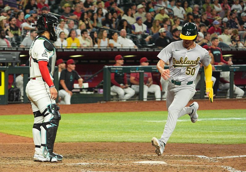 Jun 28, 2024; Phoenix, Arizona, USA; Oakland Athletics infielder Armando Alvarez (50) scores in the eighth inning inning against the Arizona Diamondbacks at Chase Field. Mandatory Credit: Allan Henry-USA TODAY Sports