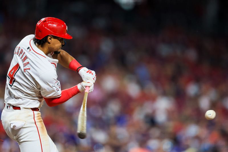 Jul 30, 2024; Cincinnati, Ohio, USA; Cincinnati Reds designated hitter Santiago Espinal (4) hits a double against the Chicago Cubs in the eighth inning at Great American Ball Park. Mandatory Credit: Katie Stratman-USA TODAY Sports