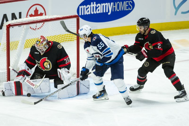 Feb 26, 2025; Ottawa, Ontario, CAN; Ottawa Senators goalie Linus Ullmark (35) makes a save in front of  Winnipeg Jets center Mark Scheifele (55) as Senators defenseman Artem Zub (2) moves in to defend in the third period at the Canadian Tire Centre. Mandatory Credit: Marc DesRosiers-Imagn Images