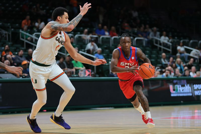 Jan 18, 2025; Coral Gables, Florida, USA; Southern Methodist Mustangs guard Boopie Miller (2) drives to the basket past Miami Hurricanes center Lynn Kidd (1) during the first half at Watsco Center. Mandatory Credit: Sam Navarro-Imagn Images