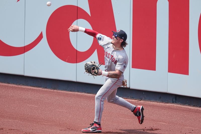 Jul 6, 2024; Bronx, New York, USA; Boston Red Sox center fielder Jarren Duran (16) throws the ball in from left field during the fourth inning against the New York Yankees at Yankee Stadium. Mandatory Credit: Vincent Carchietta-USA TODAY Sports