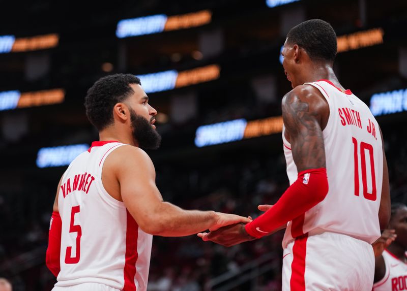 HOUSTON, TEXAS - OCTOBER 10: Fred VanVleet #5 of the Houston Rockets hi-fives Jabari Smith Jr. #10 of the Houston Rockets during the preseason game against the Indiana Pacers at Toyota Center on October 10, 2023 in Houston, Texas. NOTE TO USER: User expressly acknowledges and agrees that, by downloading and or using this photograph, User is consenting to the terms and conditions of the Getty Images License Agreement. (Photo by Alex Bierens de Haan/Getty Images)