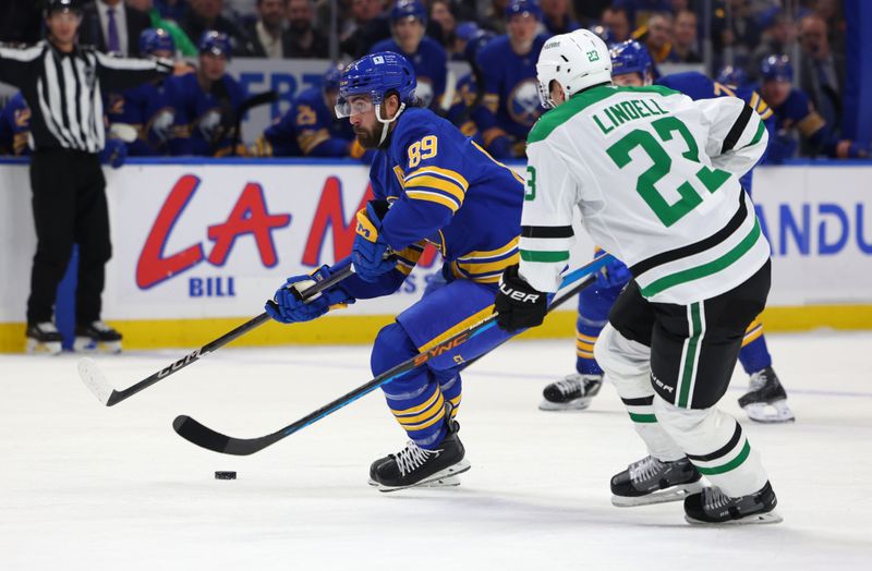 Oct 22, 2024; Buffalo, New York, USA;  Buffalo Sabres right wing Alex Tuch (89) looks to take a shot on goal as Dallas Stars defenseman Esa Lindell (23) defends during the second period at KeyBank Center. Mandatory Credit: Timothy T. Ludwig-Imagn Images