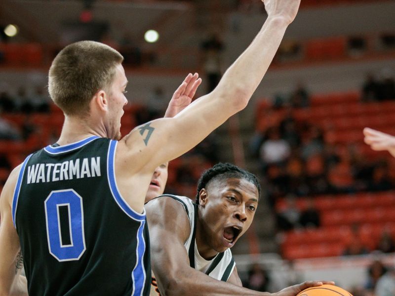 Feb 17, 2024; Stillwater, Oklahoma, USA; Oklahoma State Cowboys guard Quion Williams (5) passes around Brigham Young Cougars forward Noah Waterman (0) during the first half at Gallagher-Iba Arena. Mandatory Credit: William Purnell-USA TODAY Sports