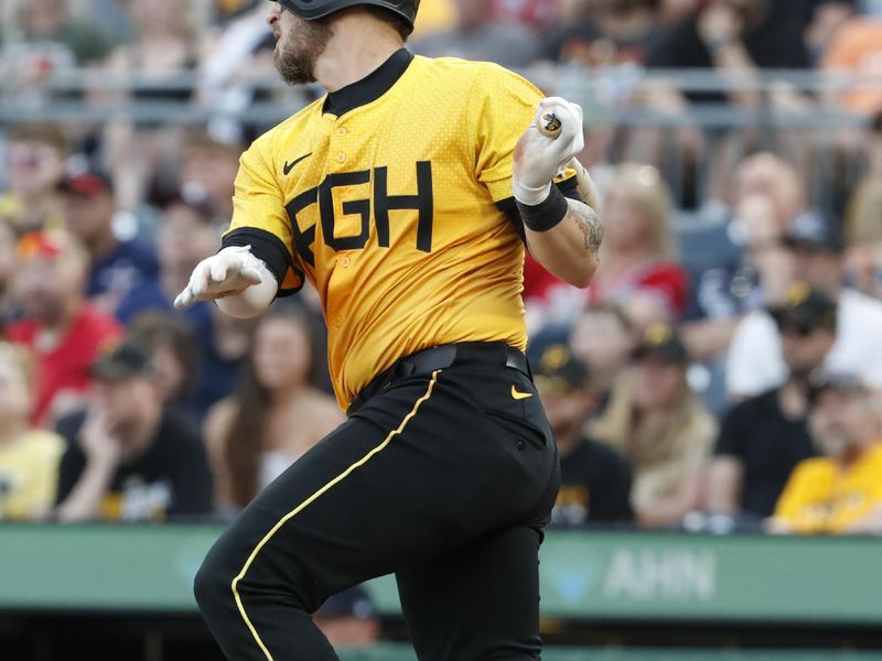 May 24, 2024; Pittsburgh, Pennsylvania, USA;  Pittsburgh Pirates catcher Yasmani Grandal (6) hits a two-run double against the Atlanta Braves during the third inning at PNC Park. Mandatory Credit: Charles LeClaire-USA TODAY Sports