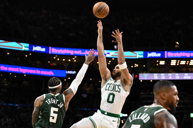 BOSTON, MASSACHUSETTS - OCTOBER 28: Jayson Tatum #0 of the Boston Celtics attempts a shot past Gary Trent Jr. #5 of the Milwaukee Bucks during the second half at the TD Garden on October 28, 2024 in Boston, Massachusetts. NOTE TO USER: User expressly acknowledges and agrees that, by downloading and or using this photograph, User is consenting to the terms and conditions of the Getty Images License Agreement. (Photo by Brian Fluharty/Getty Images)