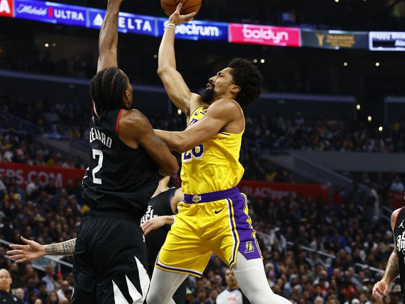 LOS ANGELES, CALIFORNIA - FEBRUARY 28:  Spencer Dinwiddie #26 of the Los Angeles Lakers takes a shot against Kawhi Leonard #2 of the LA Clippers in the second half at Crypto.com Arena on February 28, 2024 in Los Angeles, California.  NOTE TO USER: User expressly acknowledges and agrees that, by downloading and/or using this photograph, user is consenting to the terms and conditions of the Getty Images License Agreement.  (Photo by Ronald Martinez/Getty Images)