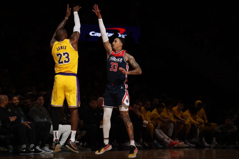 WASHINGTON, DC -? APRIL 3: Kyle Kuzma #33 of the Washington Wizards plays defense against LeBron James #23 of the Los Angeles Lakers during the game on April 3, 2024 at Capital One Arena in Washington, DC. NOTE TO USER: User expressly acknowledges and agrees that, by downloading and or using this Photograph, user is consenting to the terms and conditions of the Getty Images License Agreement. Mandatory Copyright Notice: Copyright 2024 NBAE (Photo by Stephen Gosling/NBAE via Getty Images)