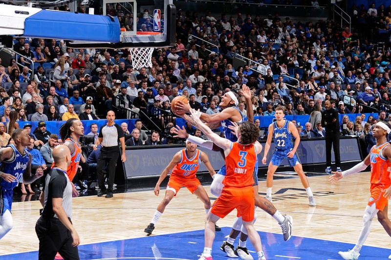 ORLANDO, FL - FEBRUARY 13: Paolo Banchero #5 of the Orlando Magic shoots the ball during the game against the Oklahoma City Thunder on February 13, 2024 at the Kia Center in Orlando, Florida. NOTE TO USER: User expressly acknowledges and agrees that, by downloading and or using this photograph, User is consenting to the terms and conditions of the Getty Images License Agreement. Mandatory Copyright Notice: Copyright 2024 NBAE (Photo by Fernando Medina/NBAE via Getty Images)